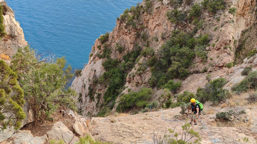Dry canyoning in the Porto Flavia Channel with sea views of the south-west coast of Sardinia