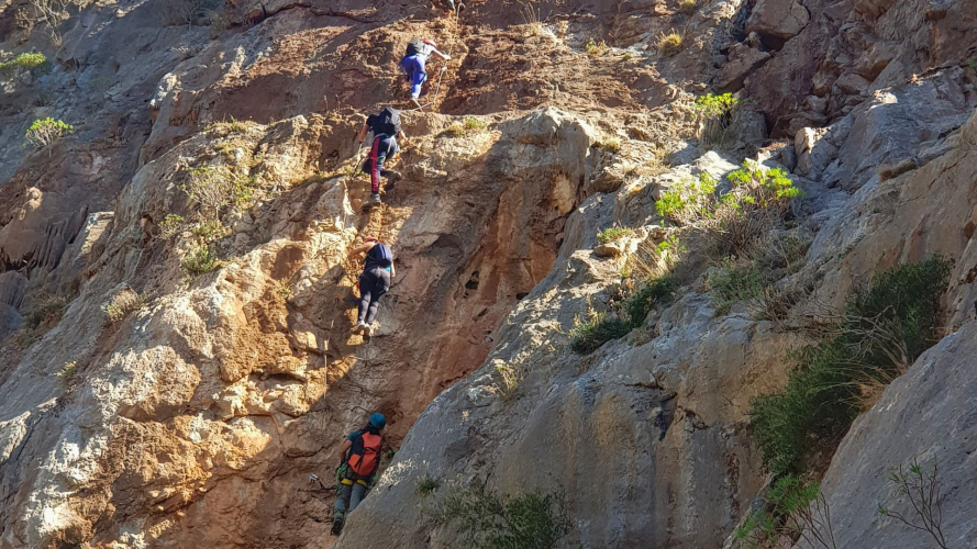 People climbing a via ferrata in the Sulcis-Iglesiente area