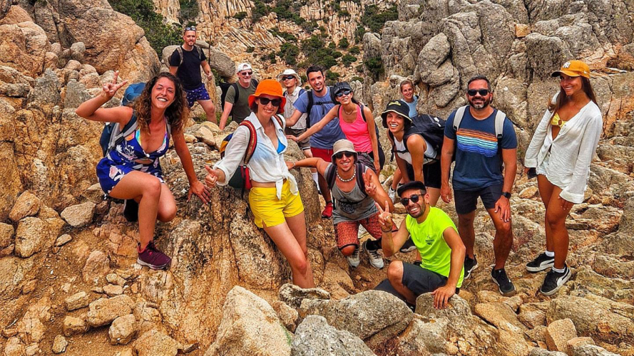 Happy hikers among the rocks of Caprera