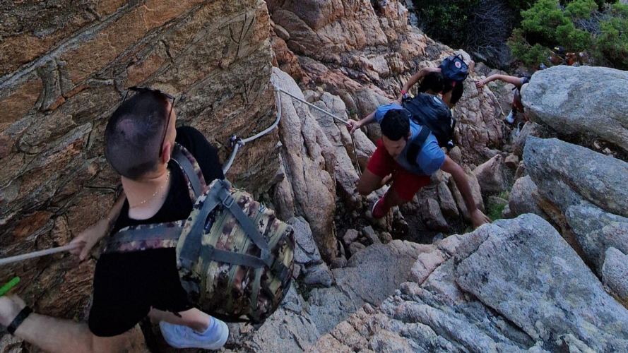 Hikers cross a point in Coticcio Cove.