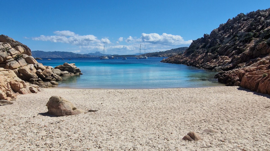 Beach and blue water at Cala Coticcio