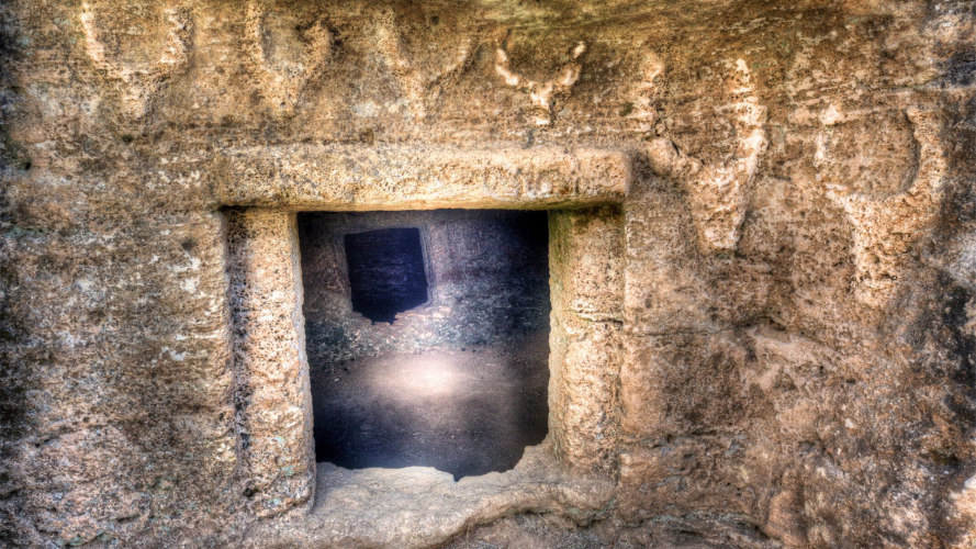 Entrance to a domus de janas in the Alghero area with ancient symbols