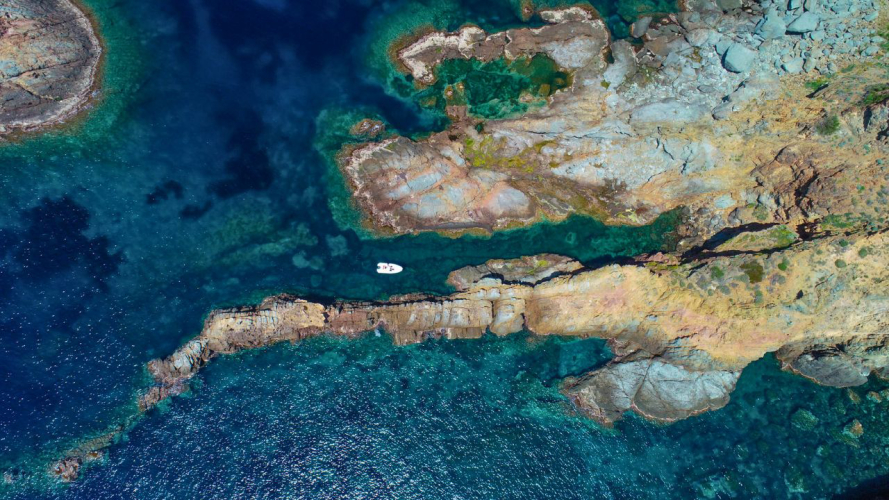 dinghy on snorkelling excursion in the crystal-clear waters of the wild north-west coast