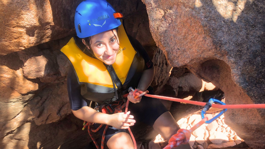 Girl and abseil during guided hike in Cala Luas