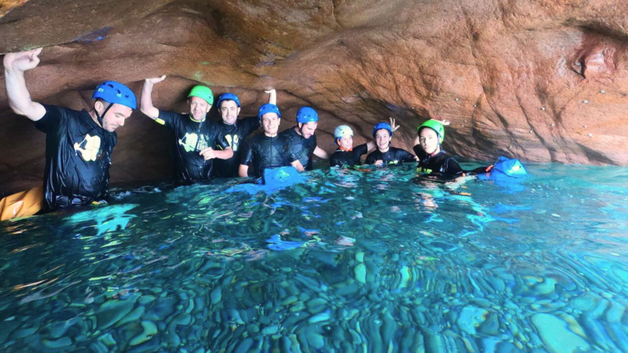 Group of hikers during a guided experience in the sea of the Gulf of Orosei