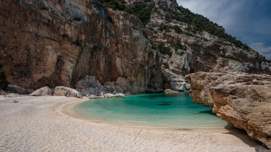 Cala Mariolu beach with its white pebbles and clear blue waters