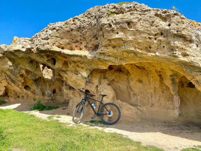 Bike tour stop at an incredible rock formation in the Sinis Peninsula