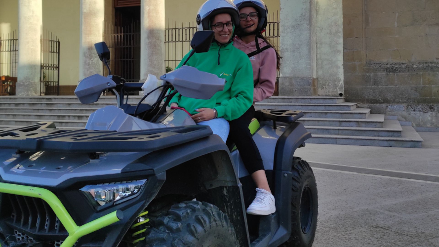 Two people on a ATV in the centre of Guasila in the province of Cagliari