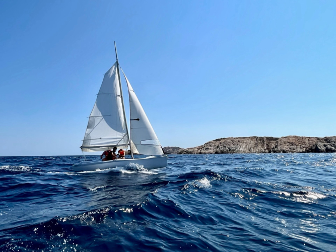 Small sailing boat sailing in La Maddalena