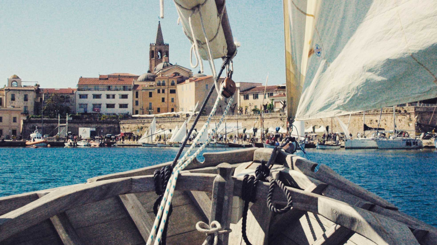 Lateen sailboat sailing in the sea of Alghero