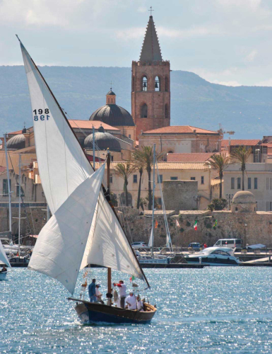 Lateen sailboat sailing in the sea of Alghero