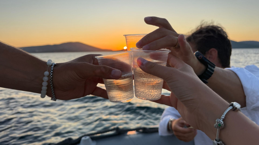 Toast on board the dinghy at Porto Conte during the private tour