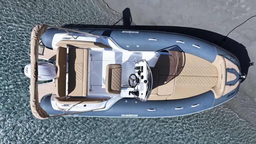 Dinghy in the crystal-clear waters of Villasimius