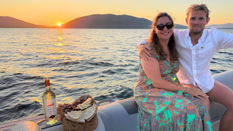 Couple on board the private tour to Alghero during the romantic sunset aperitif