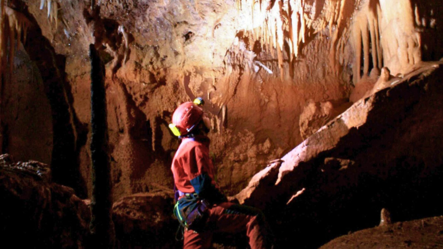 Boy during a cave excursion in Dorgali
