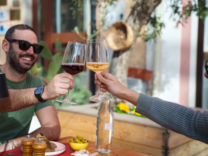 Toast with glasses of Sardinian wine in Olbia