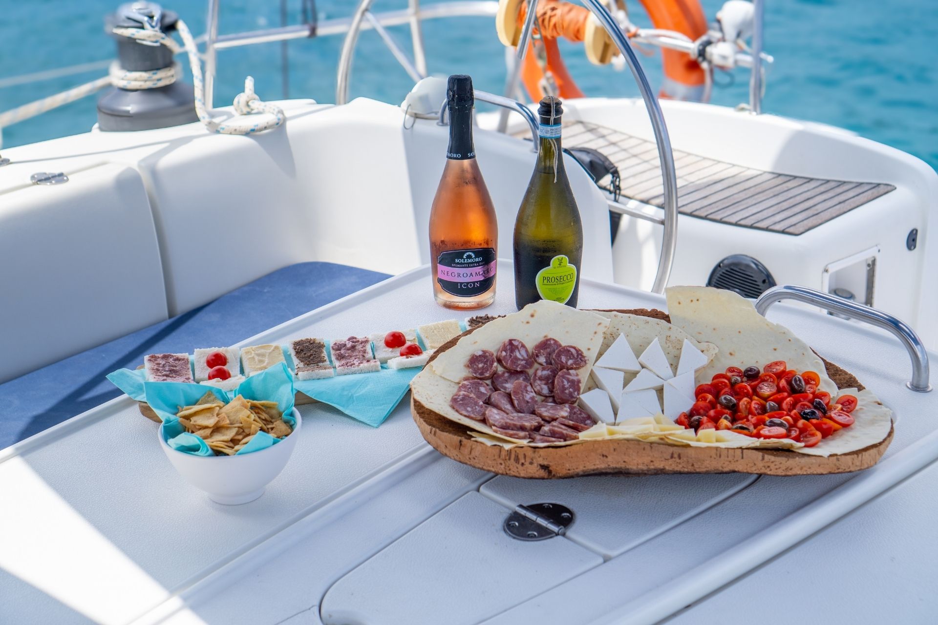 Catamaran with food and drinks on board, sailing in the archipelago of La Maddalena