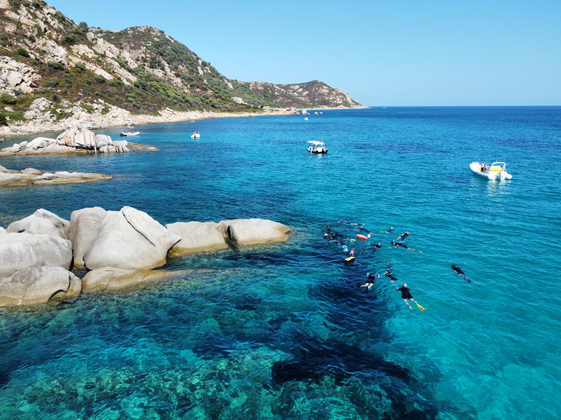 Immerse yourself in the crystal clear waters of the Molara Pools, Sardinia, during a sunset snorkeling experience. Explore the seabed of the Tavolara Marine Protected Area with colorful fish and breathtaking landscapes.