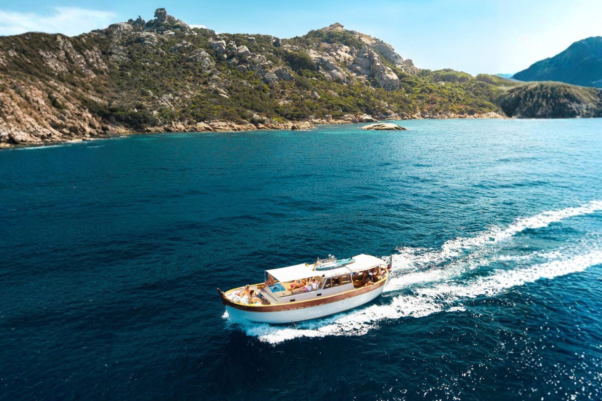 Image of an elegant period gozzo that sails between the islands of Caprera, Budelli and Spargi in the La Maddalena Archipelago.