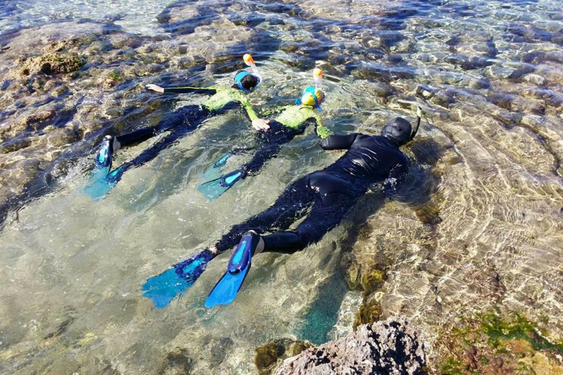 People snorkel in Balai Bay