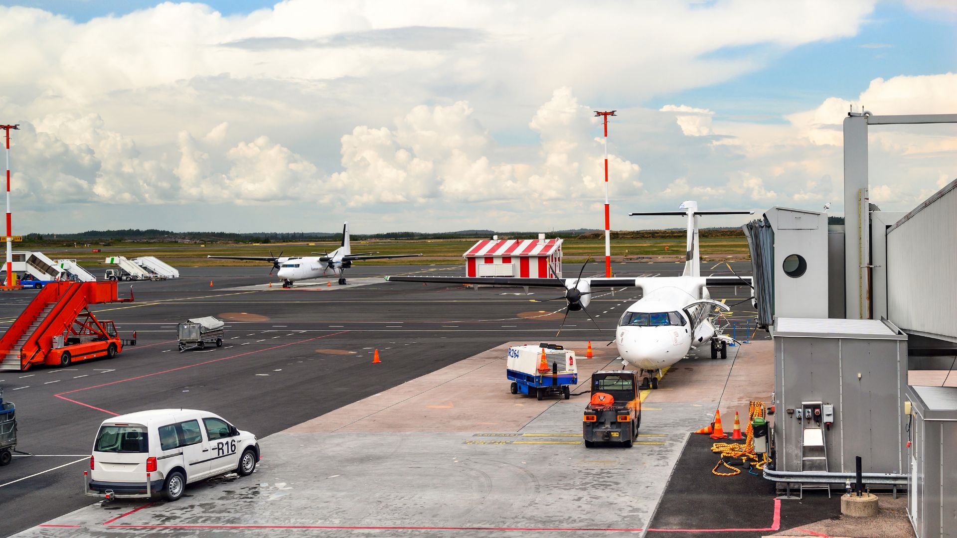 A modern shuttle bus transports passengers from an airport to a tourist destination in Sardinia