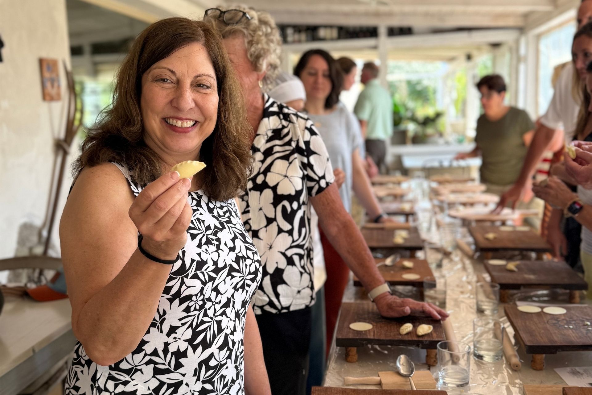 A participant shows the culurgione handmade by her during the pasta workshop in Olbia