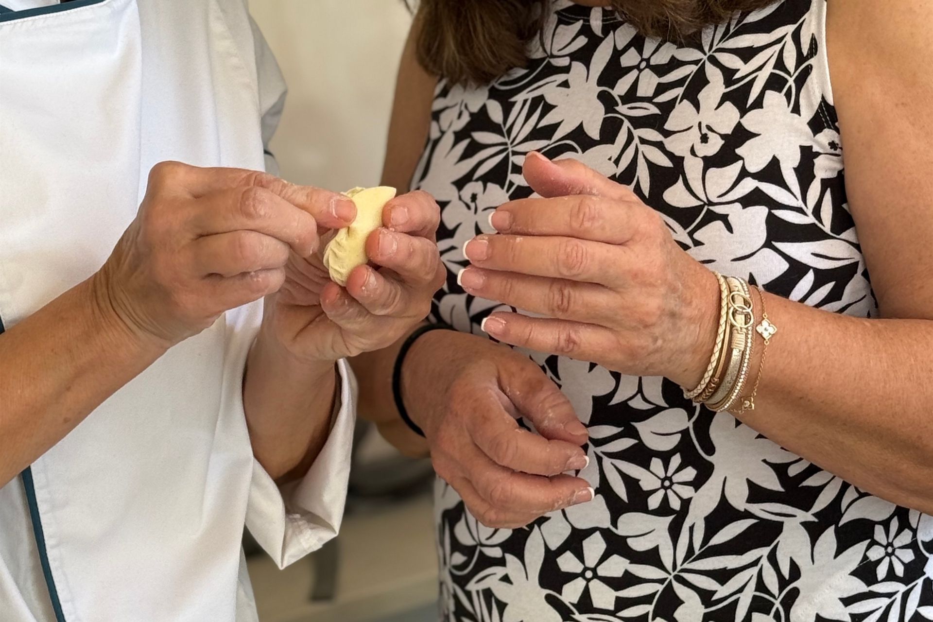 The guide demonstrates how to make culurgiones by hand during the workshop in Olbia