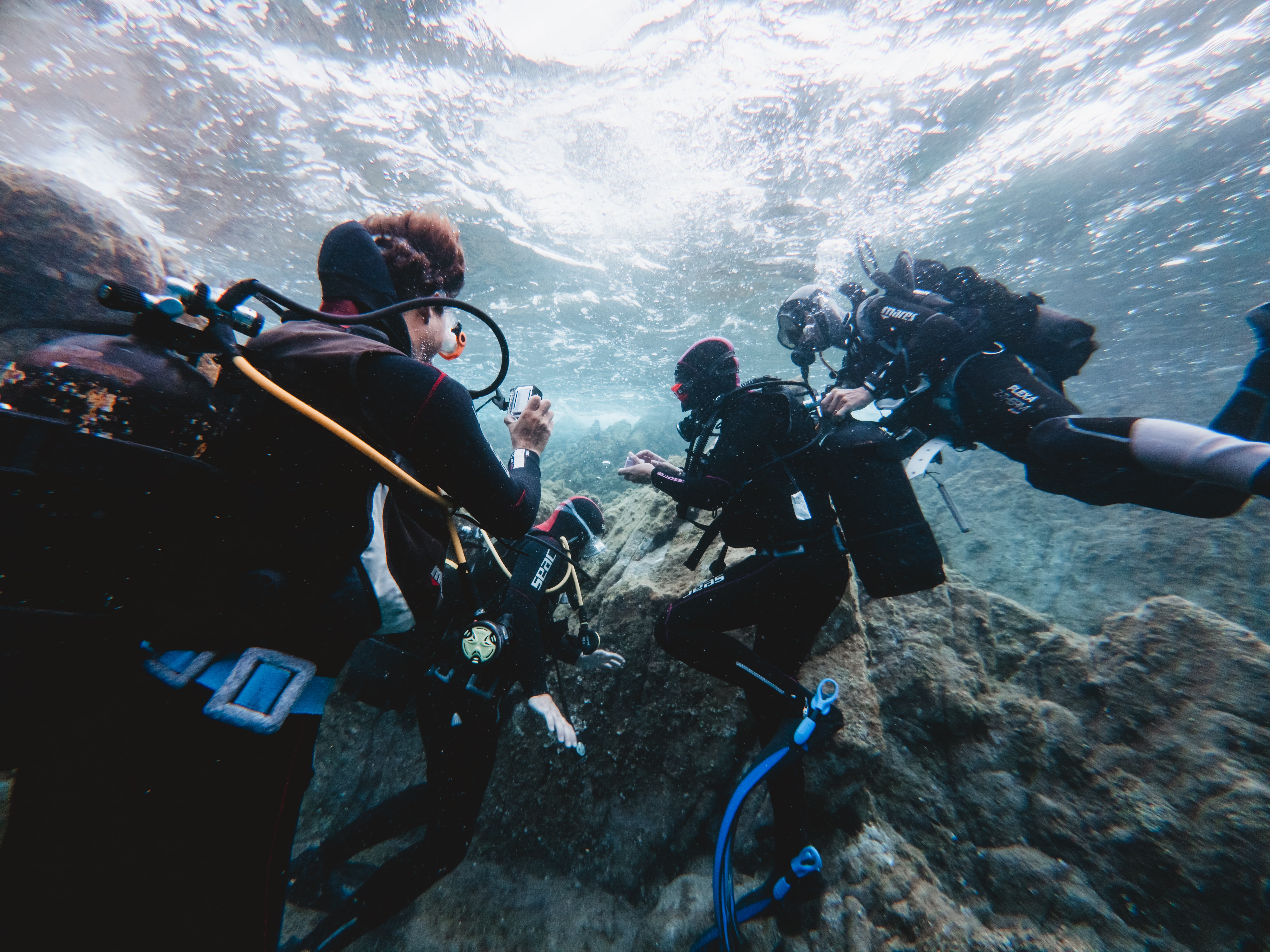 Underwater baptism experience with boat transfer from Cannigione to the La Maddalena Archipelago, including instructor and equipment, diving up to 12 meters.