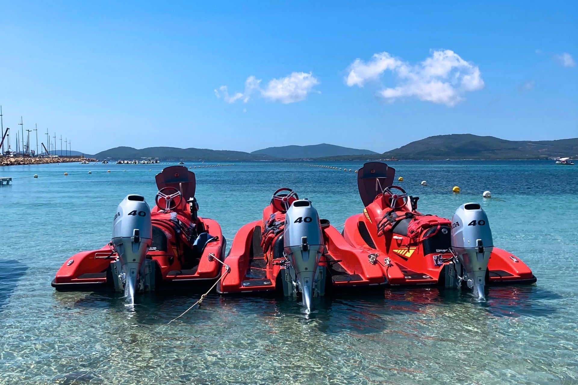Jet skis moored at the Lido of Alghero