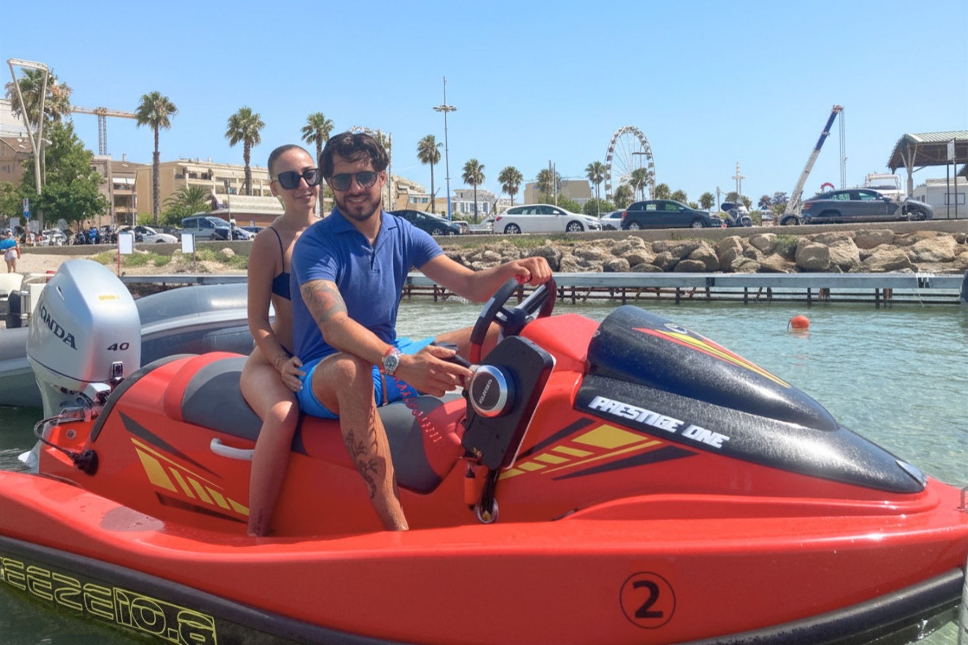 Two people enjoy a jet ski rental experience in Alghero