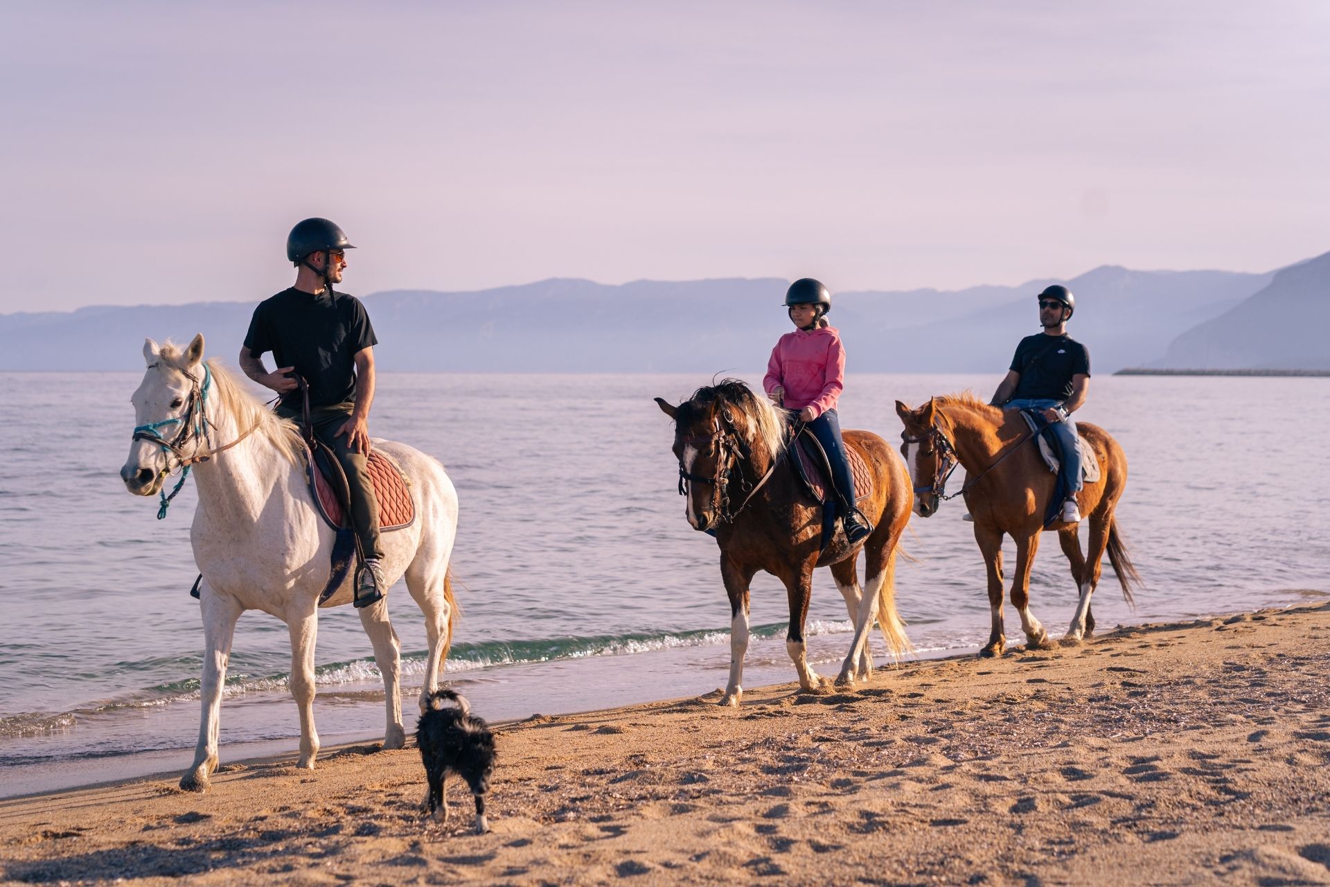 People on horseback during the sunrise excursion to Orosei