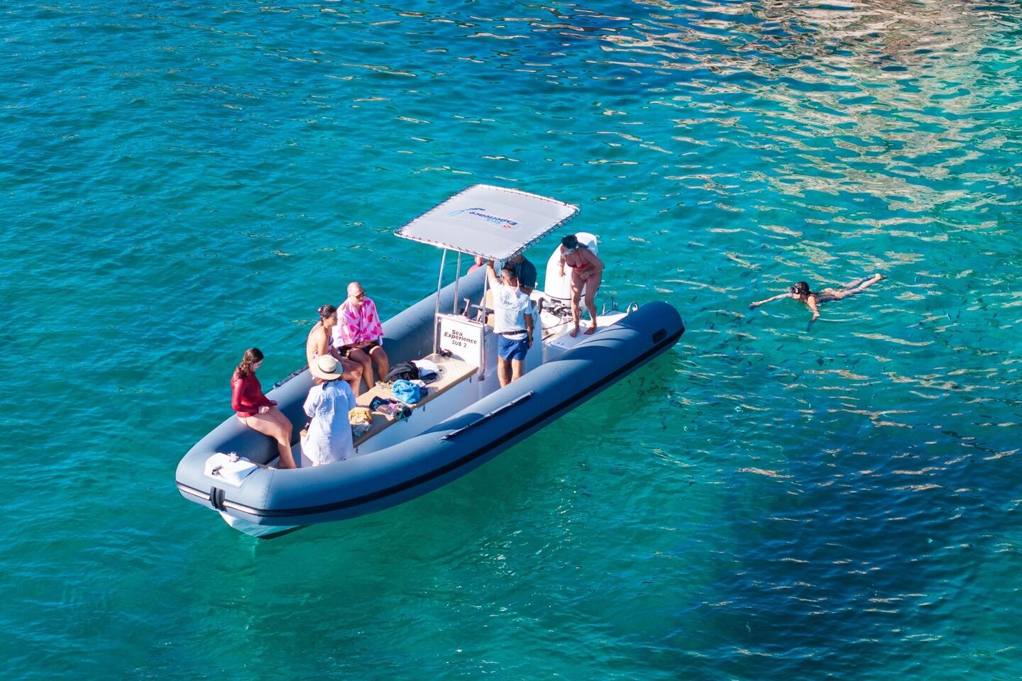 Dinghy stop for snorkeling along the shores of the Porto Conte Park
