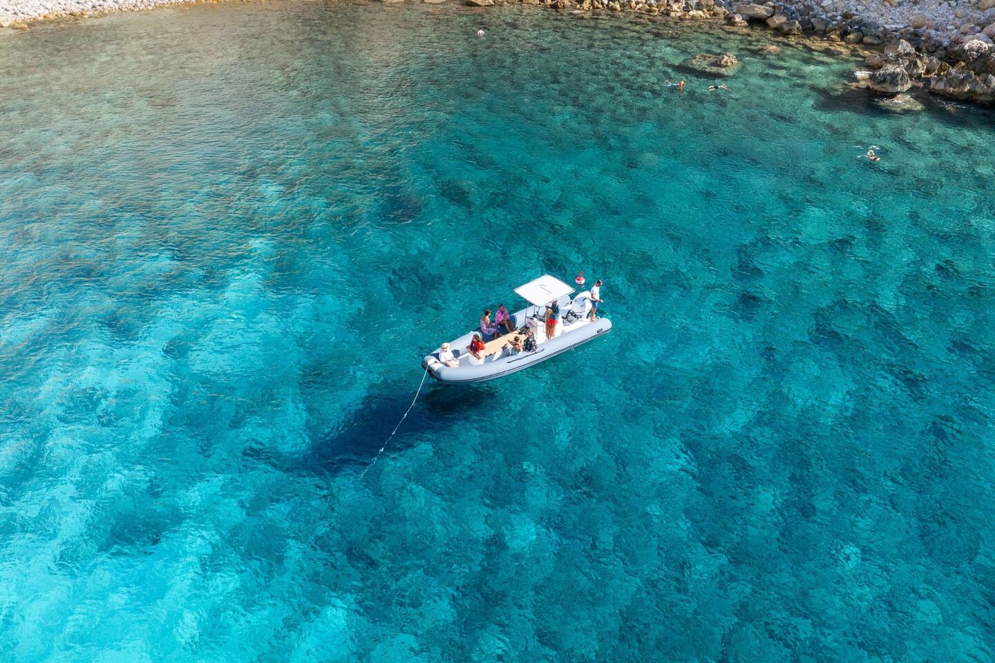 Dinghy stop for snorkeling along the shores of the Porto Conte Park