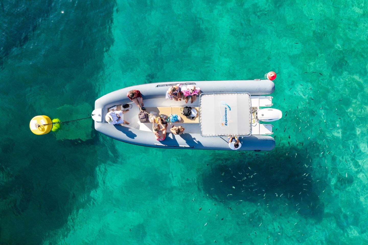 Dinghy stops near the coast of the Porto Conte Park
